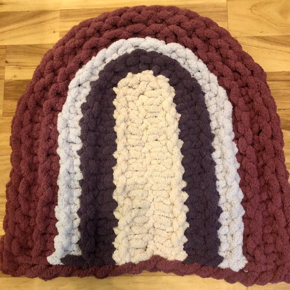 Chunky rainbow blanket mat made from chenille luxury yarn.